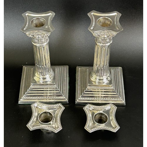 403 - A pair of Edward VII Corinthian column candlesticks, Birmingham 1904, 39.1 ozt (all in), 16 cm high ... 