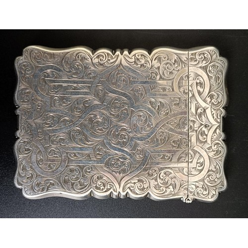 95 - A Victorian silver card case, with engraved decoration, Birmingham 1864, 2.2 ozt, 10 cm high