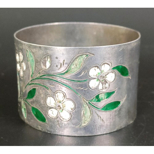 223 - A Victorian silver and enamel napkin ring, decorated flowers, London 1875, 28.8 g (all in)