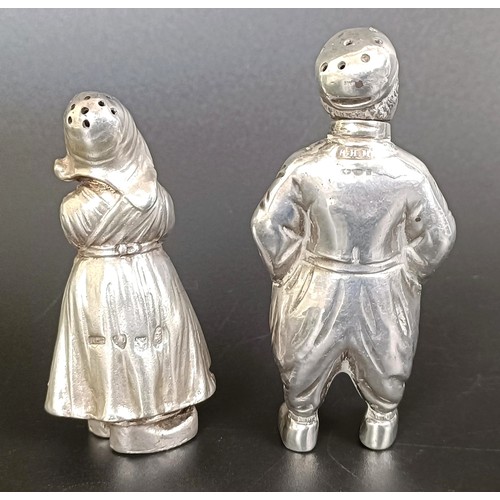 225 - A pair of Berthold Muller silver novelty peppers, in the form of a boy and a girl, 93 g