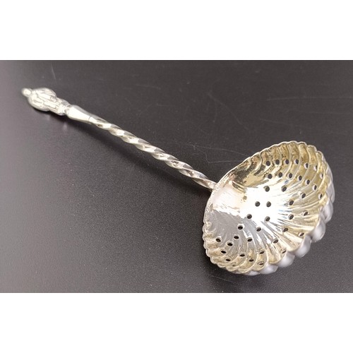 110 - A George III silver toddy ladle, with a turned wooden handle, and assorted silver coloured metal spo... 