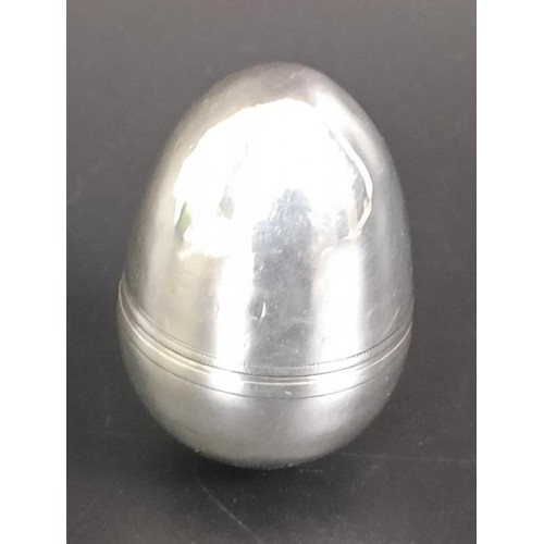 213 - A 19th century silver coloured metal nutmeg grater, in the form of the egg, 4 cm