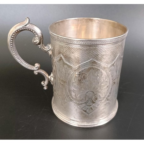 187 - A Victorian silver mug, with engine turned decoration, inscribed and dated, London 1871, 6.1 ozt, 10... 