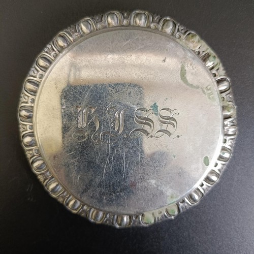 87 - An 18th century Continental silver coloured metal toilet box, initialled, 4.5 ozt, 7 cm diameter