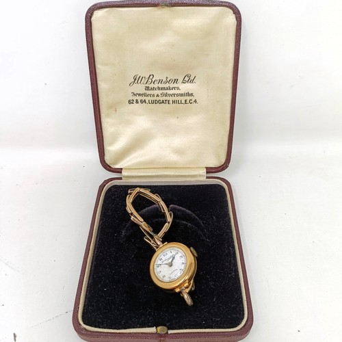 913 - A ladies 9ct gold wristwatch, on an expandable strap, in a vintage J W Benson box