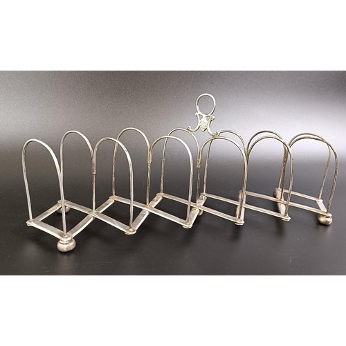 251 - A silver coloured metal collapsible toast rack, 10.5 cm wide