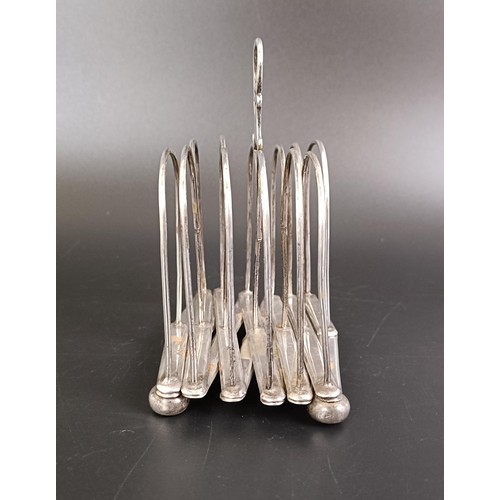 251 - A silver coloured metal collapsible toast rack, 10.5 cm wide