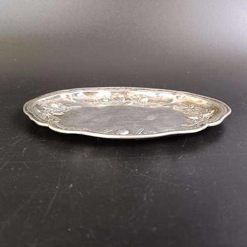 253 - A George III silver pin tray, decorated birds, fruit and foliage, Sheffield 1813, 2.9 ozt 15 cm wide