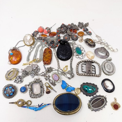 833 - An amber and silver coloured metal pendant on a chain, and assorted other costume jewellery