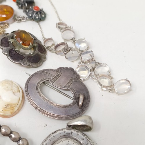 833 - An amber and silver coloured metal pendant on a chain, and assorted other costume jewellery