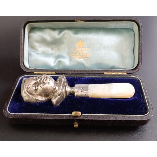 279 - A Victorian baby's silver rattle, with mother of pearl teether, London 1881, cased