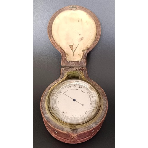 1153 - A good late 19th/early 20th century pocket combined barometer, thermometer and compass, in a leather... 