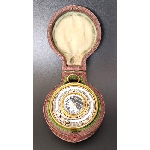 1153 - A good late 19th/early 20th century pocket combined barometer, thermometer and compass, in a leather... 