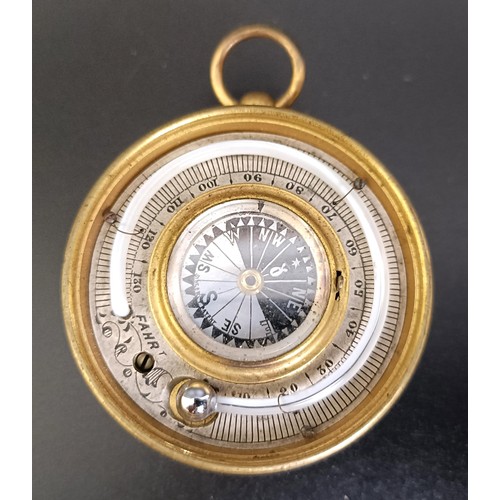 1153 - A good late 19th/early 20th century pocket combined barometer, thermometer and compass, in a leather... 