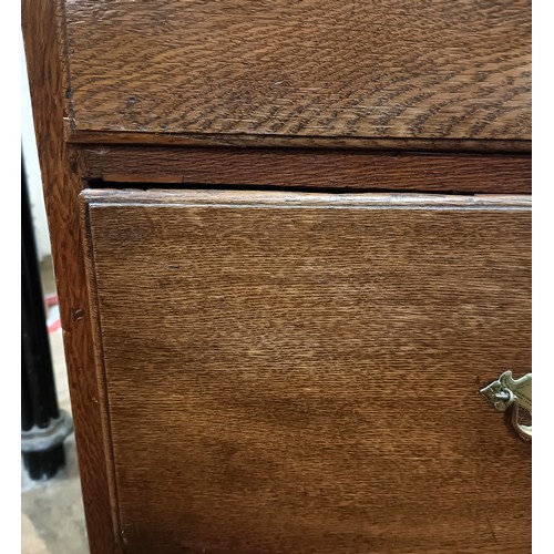 1200 - A 19th century oak chest on chest, the top having three short and three long drawers, on a base with... 