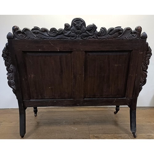 1211 - A carved oak hall bench, 157 cm wide