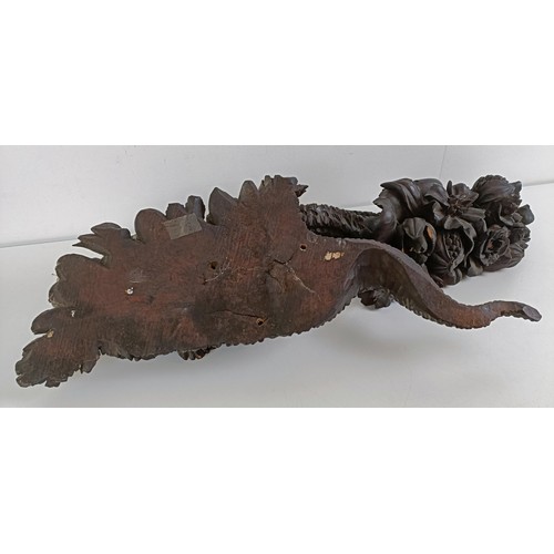 1018 - A pair of carved wooden mounts, cornucopias filled with flowers and fruit (2)