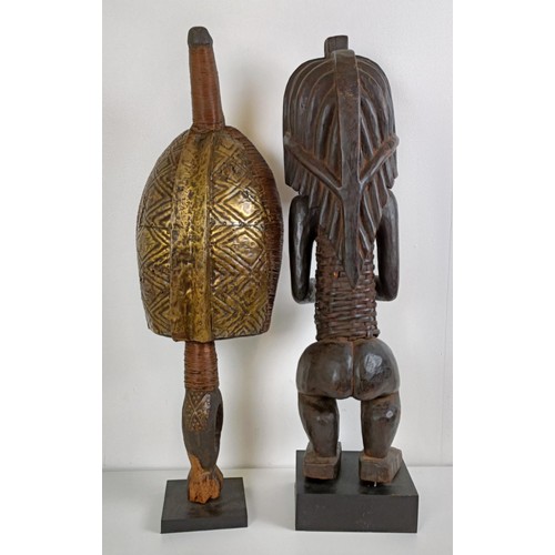 1055 - An African sculpture, 17 cm high, and another 69 cm high (2)