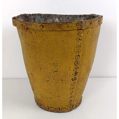 1056 - A painted leather fire bucket, 27 cm high...