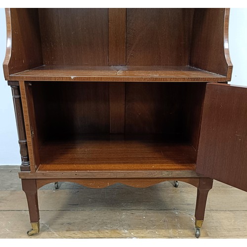 1221 - A mahogany waterfall bookcase, with a cupboard door to base, 51 cm wide