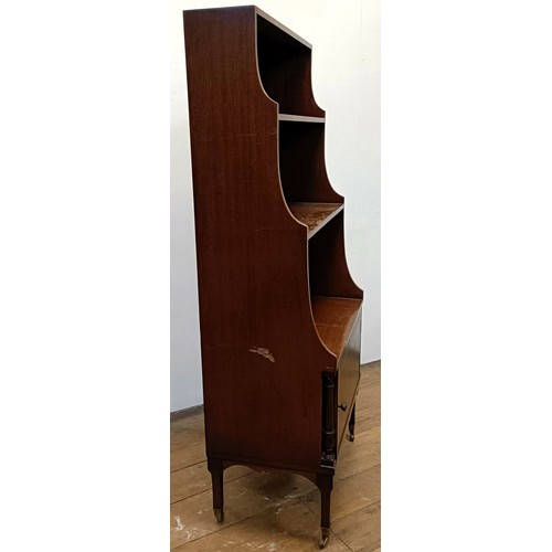 1221 - A mahogany waterfall bookcase, with a cupboard door to base, 51 cm wide