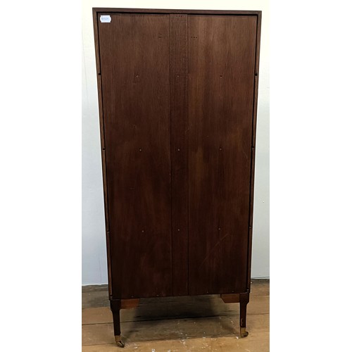 1221 - A mahogany waterfall bookcase, with a cupboard door to base, 51 cm wide