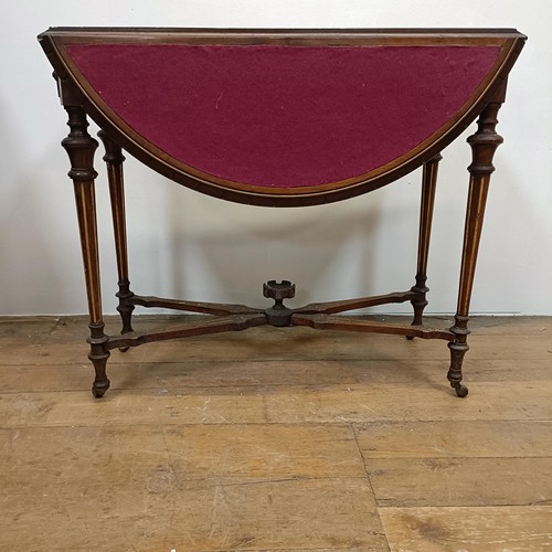 1226 - A 19th century walnut folding card table, on turned tapering legs, joined by an X stretcher, 93 cm w... 