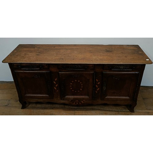 1231 - A 19th century Continental walnut dresser base, having three drawers and three cupboard doors, 192 c... 