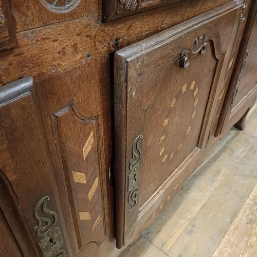 1231 - A 19th century Continental walnut dresser base, having three drawers and three cupboard doors, 192 c... 