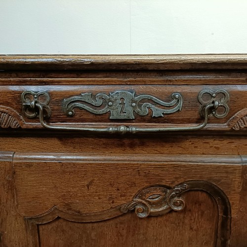 1231 - A 19th century Continental walnut dresser base, having three drawers and three cupboard doors, 192 c... 