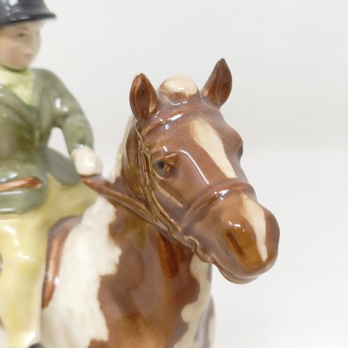 1002 - A Beswick Boy's Pony, palomino, 1500, and a Girl's Pony, skewbald, 1499, (chip to hoof), both g... 