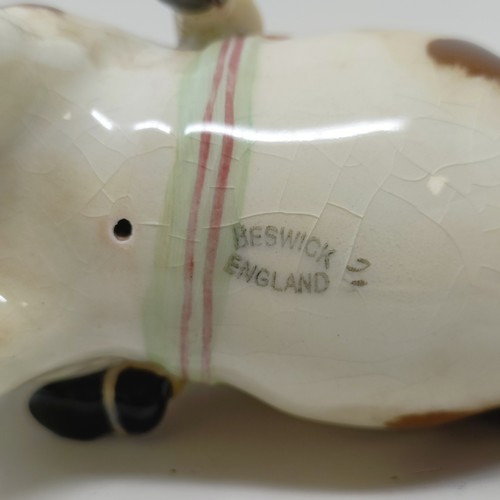 1002 - A Beswick Boy's Pony, palomino, 1500, and a Girl's Pony, skewbald, 1499, (chip to hoof), both g... 