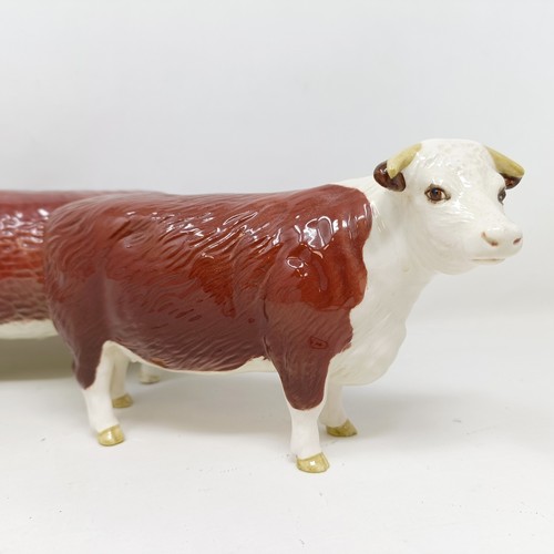 1003 - A Beswick Hereford Bull, 1363A, a Hereford Cow, 1360, and a Hereford Calf, 1827C, all gloss (3)...