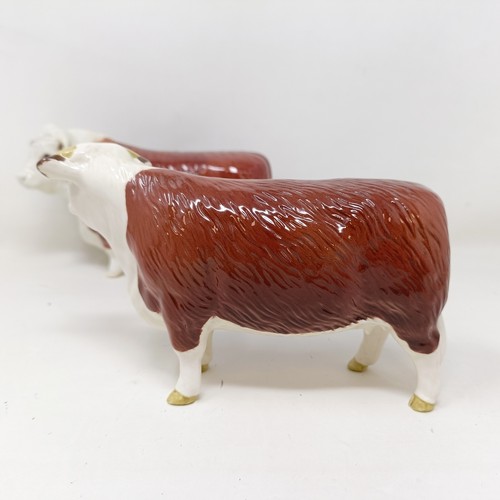 1003 - A Beswick Hereford Bull, 1363A, a Hereford Cow, 1360, and a Hereford Calf, 1827C, all gloss (3)...