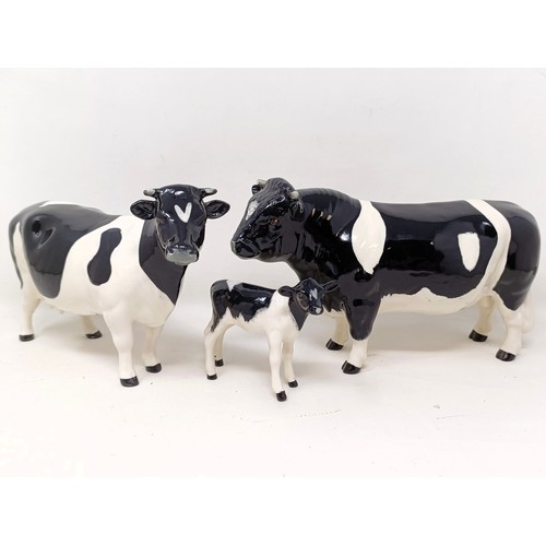 1004 - A Beswick Friesian Cow, 1362A, a Friesian Bull, 1439A, (horn chipped), and a Friesian Calf, 1249C, a...