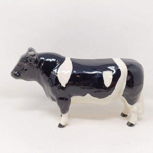 1004 - A Beswick Friesian Cow, 1362A, a Friesian Bull, 1439A, (horn chipped), and a Friesian Calf, 1249C, a...