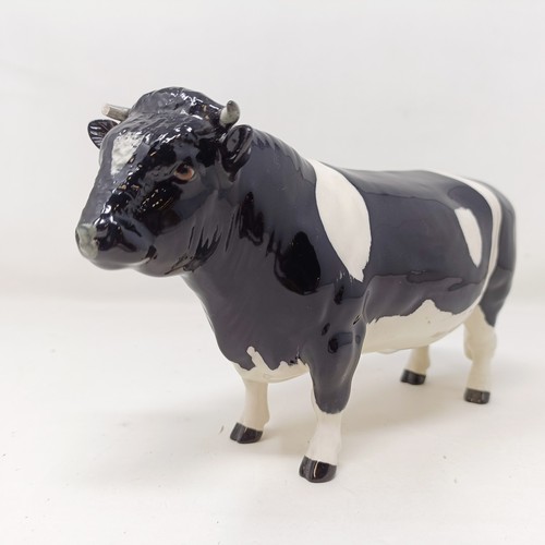 1004 - A Beswick Friesian Cow, 1362A, a Friesian Bull, 1439A, (horn chipped), and a Friesian Calf, 1249C, a...