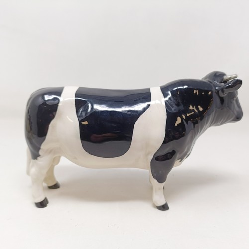 1004 - A Beswick Friesian Cow, 1362A, a Friesian Bull, 1439A, (horn chipped), and a Friesian Calf, 1249C, a...