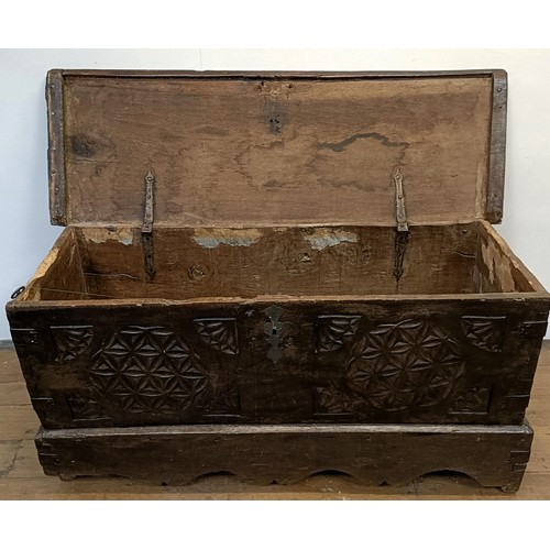 1247 - An antique Continental coffer, with a carved front, 131 cm wide