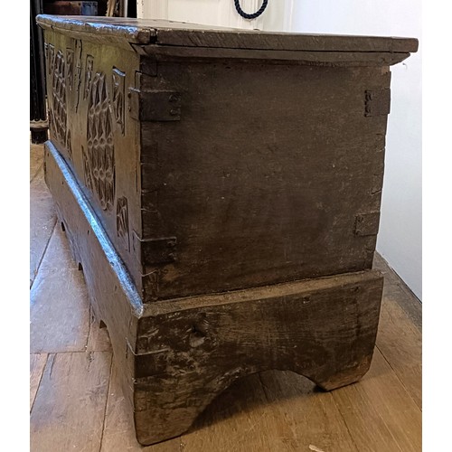 1247 - An antique Continental coffer, with a carved front, 131 cm wide