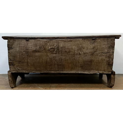 1247 - An antique Continental coffer, with a carved front, 131 cm wide