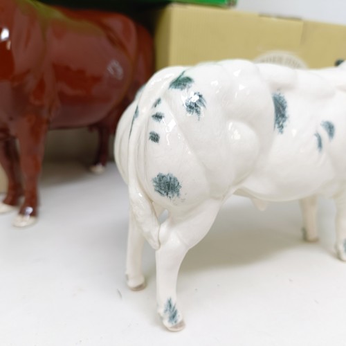 1009 - A Beswick Red Poll Cow, 4111, gloss, a Border Fine Arts Belgian Blue Bull, A4579, and a Charolais Bu... 