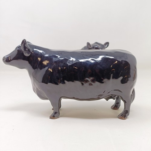 1010 - A Beswick Aberdeen Angus Bull, 1562, an Aberdeen Angus Cow, 1563, and a Jersey Cow, 1345, all gloss ... 