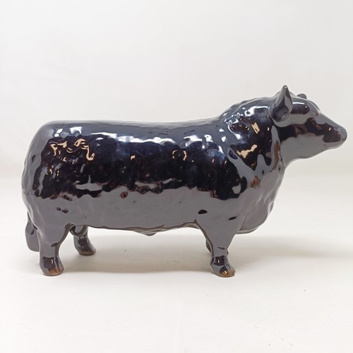 1010 - A Beswick Aberdeen Angus Bull, 1562, an Aberdeen Angus Cow, 1563, and a Jersey Cow, 1345, all gloss ...