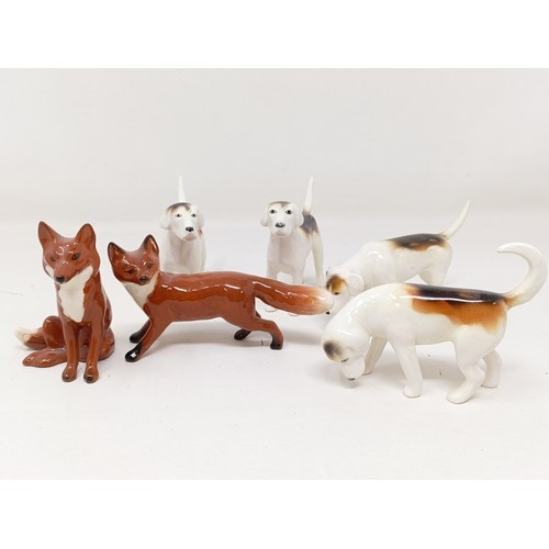 1014 - Four Beswick Foxhounds, 942 x 2, 943 and 2265, and two foxes, 1440 and 1748, all gloss (6)