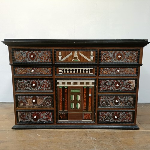 1253 - An 18th century Italian collector’s cabinet, with geometric and other inlaid decoration, the arrange... 