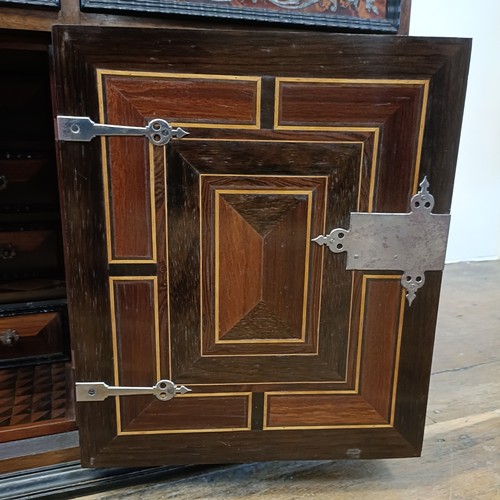 1253 - An 18th century Italian collector’s cabinet, with geometric and other inlaid decoration, the arrange... 