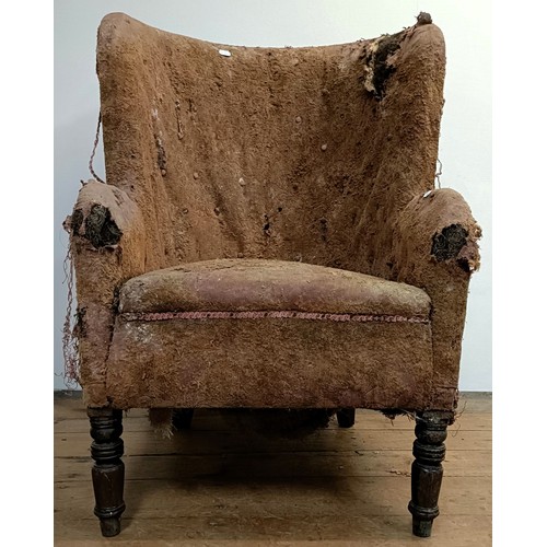 1255 - A late 19th/early 20th century tub chair, in need of extensive restoration