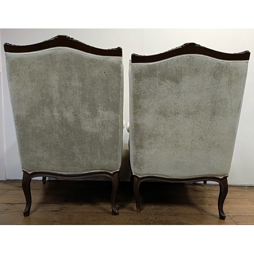 1270 - A pair of walnut framed wingback armchairs (2)