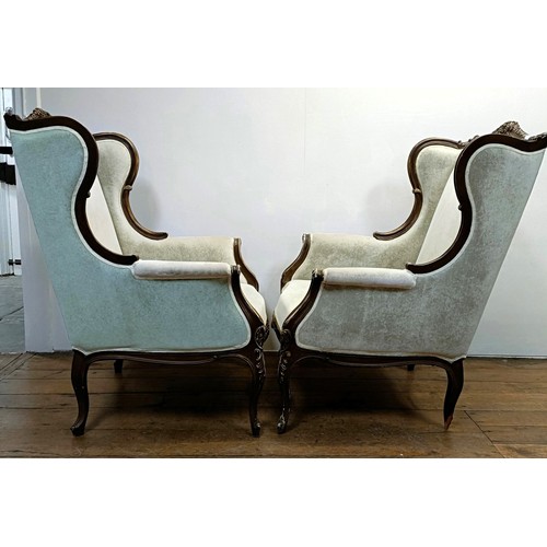 1270 - A pair of walnut framed wingback armchairs (2)